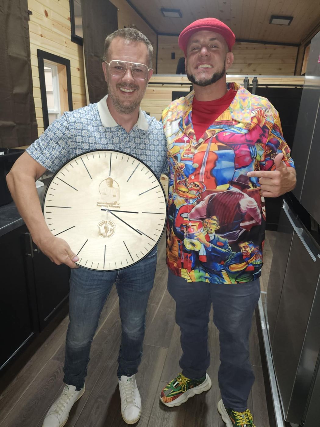 Brandon and a friend holding a SoberTalk clock